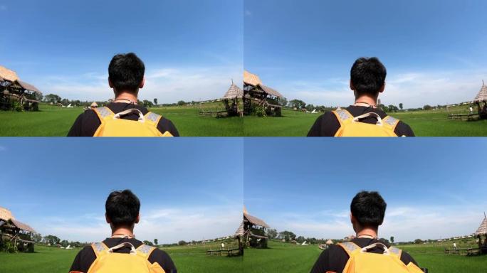 旅行者男人带着背包穿越自然和森林