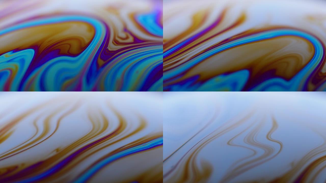 彩虹颜色变化的液体肥皂的表面。光在肥皂泡上折射，vacro关闭移动的颗粒。特写。慢动作