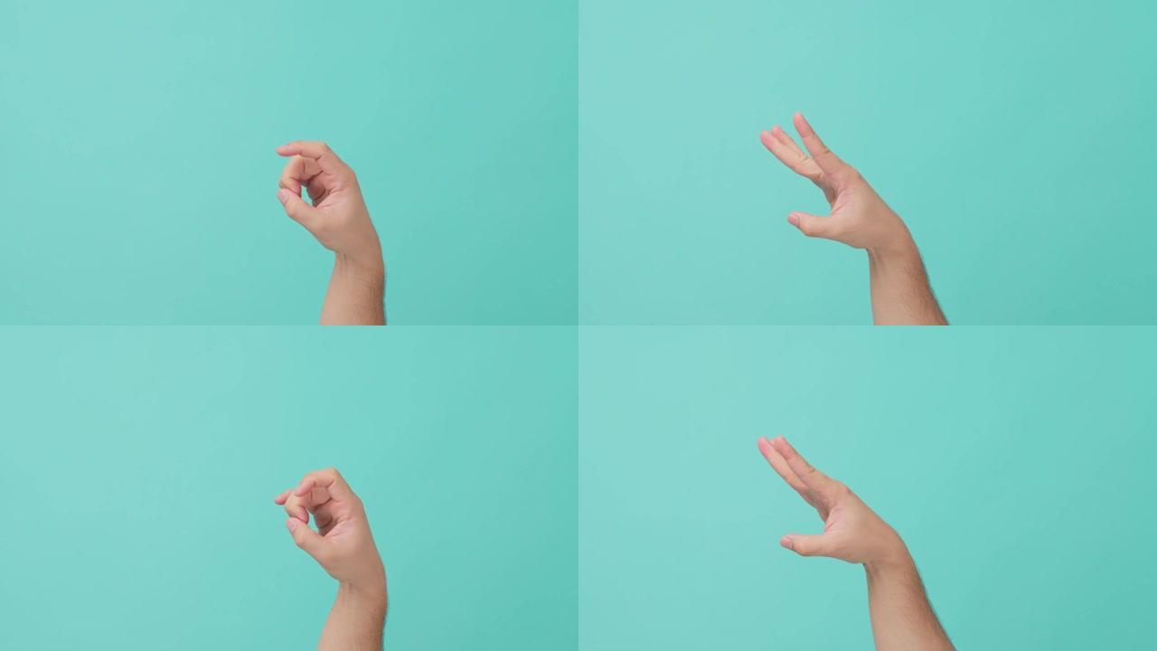 近距离拍摄的人手举伸出手轻弹。无法识别的人在孤立的蓝屏背景中显示语言符号或符号的手势，并带有广告复制