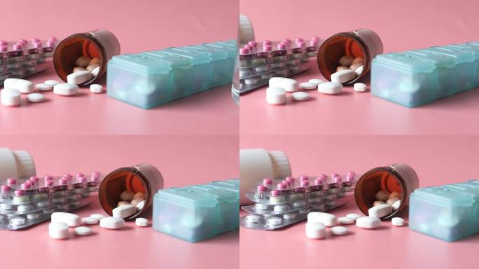 医用药丸、药盒和泡罩包装在粉红色