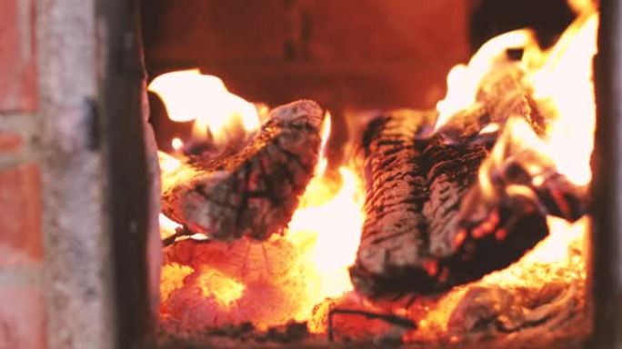 罗马尼亚农村地区的红砖壁炉和火炉内燃烧着火。
