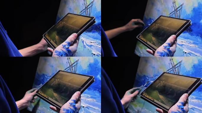 艺术家抄写员用海洋中的船绘制海景。工匠装饰师在丙烯酸色的蓝色海上航行时绘画。在平板电脑的手中。