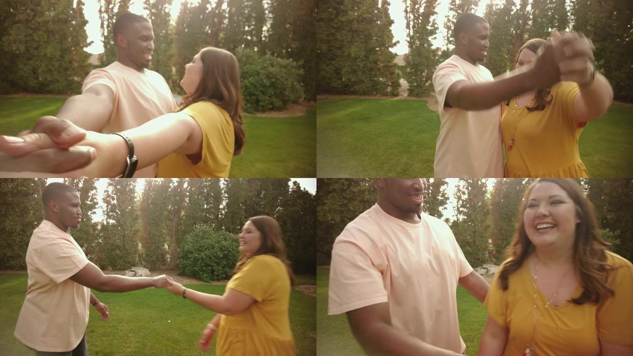 混血夫妇非裔美国男性和高加索女性户外手牵手跳舞，一起度过高质量的约会时间4k视频系列