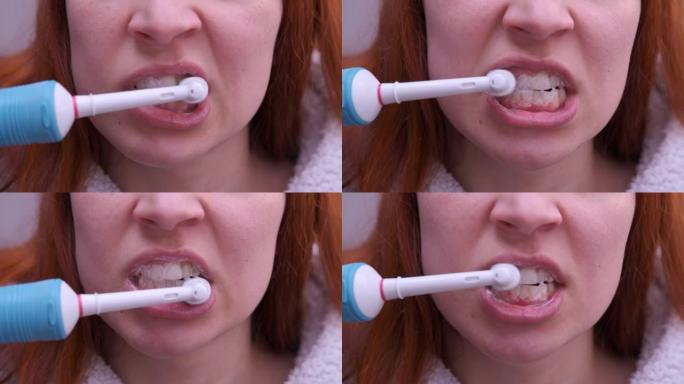 关闭年轻女子用电动牙刷刷牙