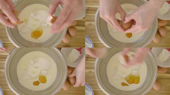 将鸡蛋切成搅拌碗的俯视图
