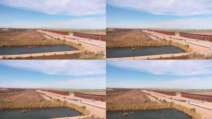 分隔美国和墨西哥的国际边境墙，从路易斯延伸到阿戈多内斯，墨西哥，尤马，亚利桑那州，视频剪辑