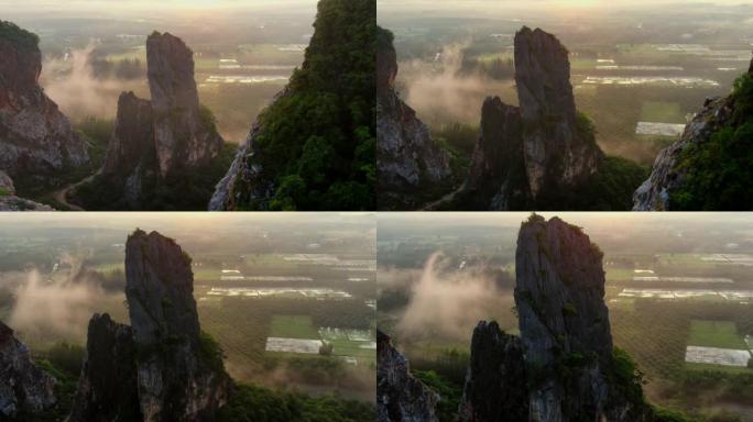 宋卡府考库哈的延时日出场景。有绿色林木的山。泰国的自然景观背景