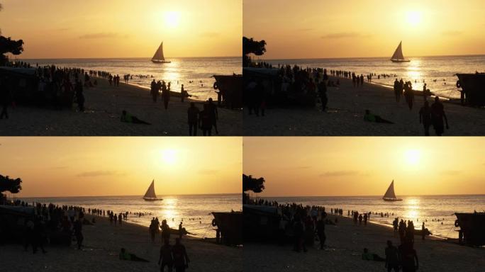 桑给巴尔海岸海滩日落时帆船单桅帆船的剪影