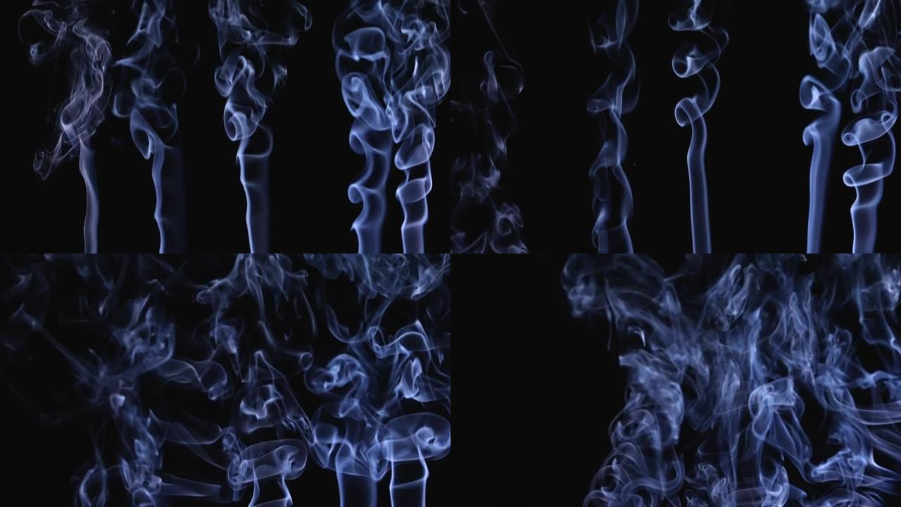 白烟以慢动作漂浮在黑色背景上的太空中。烟雾喷射形成复杂的抽象图案。特写