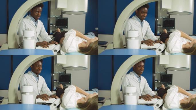 现代中心肾结石和输尿管结石碎石术。专业的非洲男子医生，使用超声波扫描为其女性患者在碎石前确定结石位置