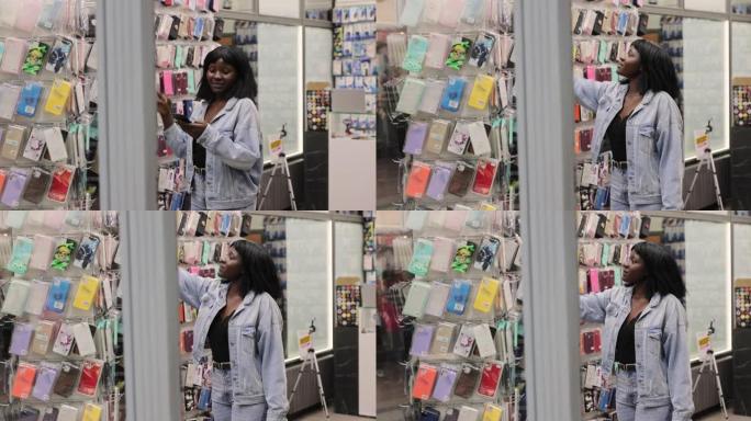 非洲妇女在商店寻找手机壳