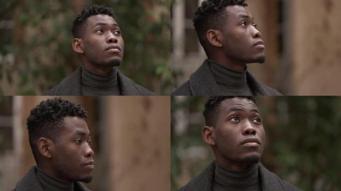 沉思的年轻黑人站在思想中