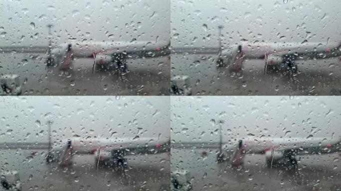 特写4k视频，雨水水滴落在飞机潮湿的挡风玻璃上