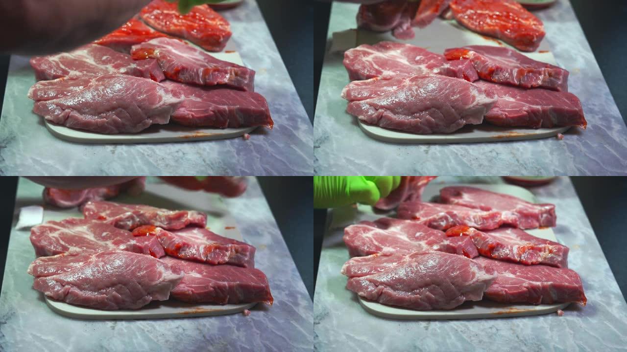 用烧烤腌泡汁刷牛排的特写镜头。食品与健康概念。