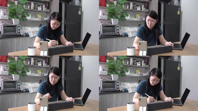 女性平面设计师在家在数字平板电脑上画画。