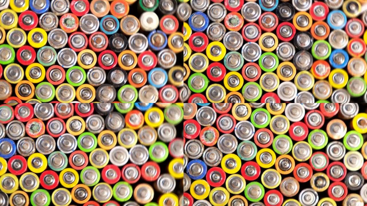 不同类型和类别的电池。许多废旧电池会旋转。
