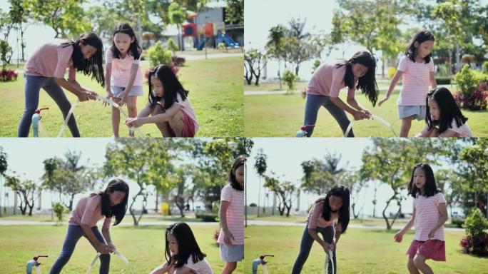 亚洲姐姐在公园户外打开水管清洁姐姐的手，关爱生活方式。