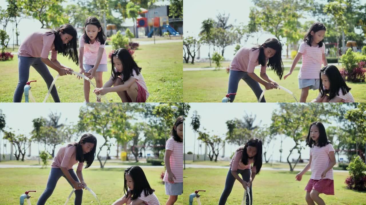 亚洲姐姐在公园户外打开水管清洁姐姐的手，关爱生活方式。