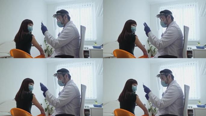 日本男医生在医院为女病人准备注射疫苗