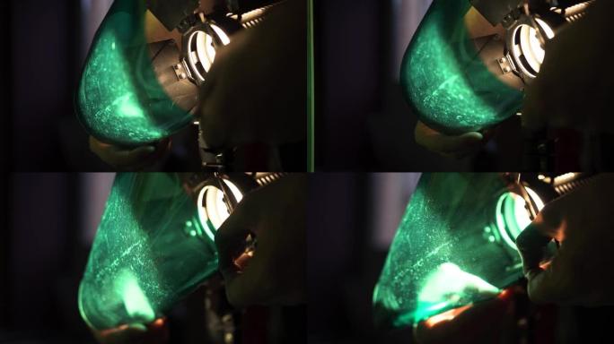 照明器将绿色凝胶滤光片放在金属光幕上