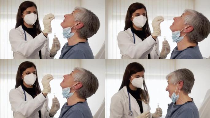 成年妇女正在医院进行口腔拭子测试-慢动作视频