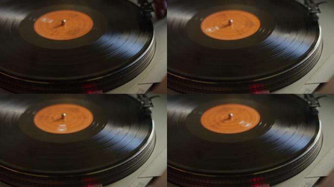 将黑胶唱片放在转盘上并开始旋转和播放音乐的特写镜头