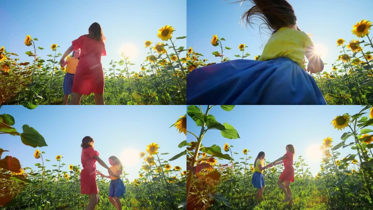 日落时分，妈妈和女儿在向日葵的田野里玩得开心。