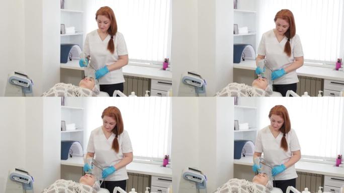 女美容师用激光治疗客户的脸