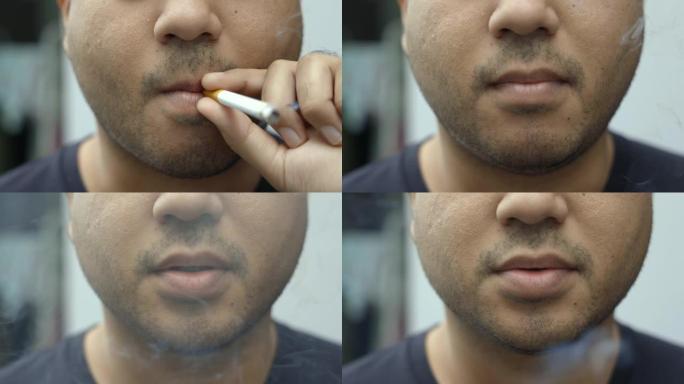年轻人抽烟，他抽烟并吐出很多烟。这对周围的人来说是危险的。世界无烟日。