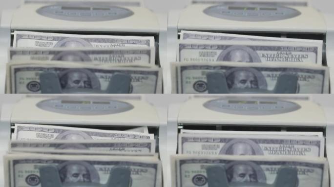 百元纸币在机器中进行记帐纸币的计数，特写。计数机计数许多美元钞票。经济学和货币的概念