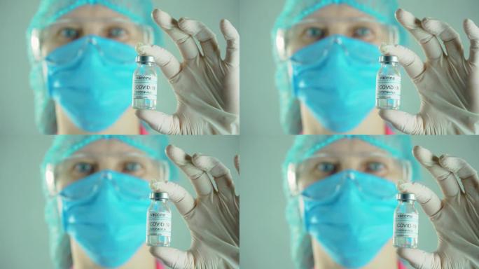 护士手持瓶抗冠状病毒疫苗药理药物制造后