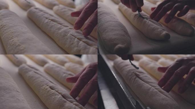 贝克使用小刀在生面包上制作图案，慢动作4k视频