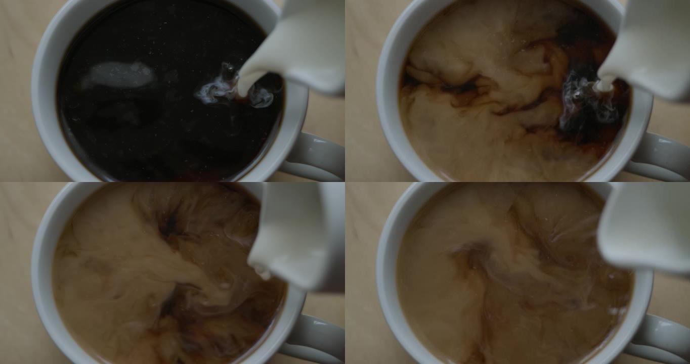 慢动作将黑咖啡倒入杯中。新鲜的早晨倒在红茶上特写。选择性聚焦。慢动作俯视图将牛奶倒入一杯热咖啡或茶中