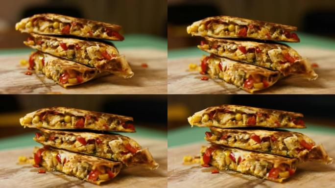 木制砧板上的新鲜油炸热鸡肉玉米饼的侧视图。制作墨西哥玉米饼的过程