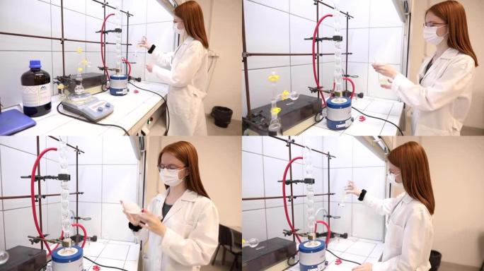 在化学实验室，大学生进行液-液萃取