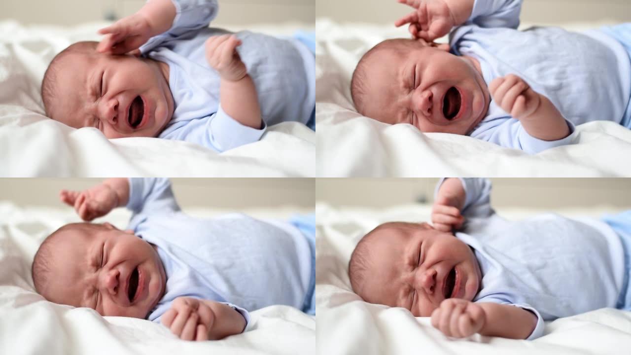 小婴儿新生哭泣，哭泣尖叫，大声哭泣。新生儿在白色毯子上躺在床上又累又饿。婴儿尖叫。健康的小孩出生后不