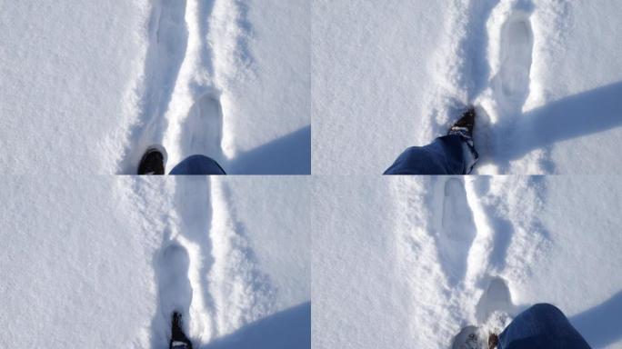 雪地里的脚运动。一个男人在雪地上行走