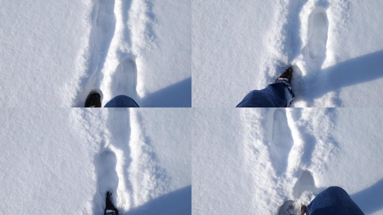 雪地里的脚运动。一个男人在雪地上行走