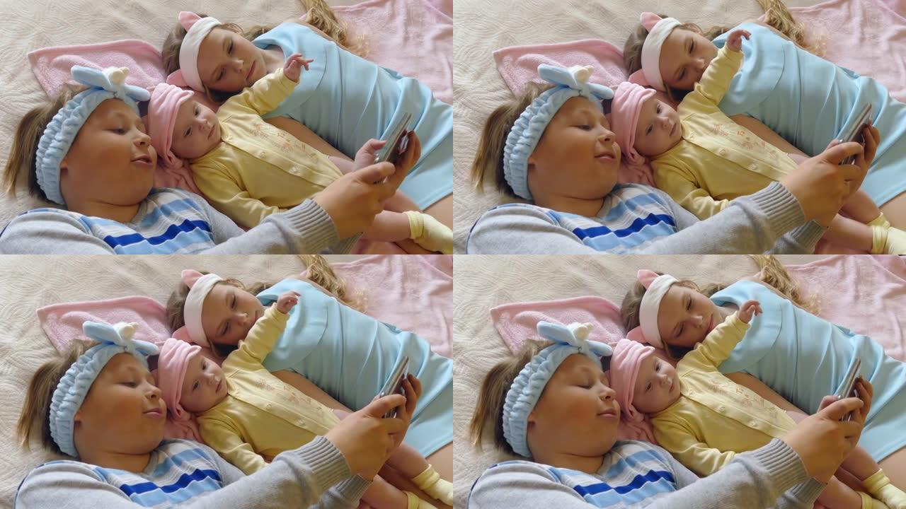 儿童在智能手机上娱乐婴儿视频