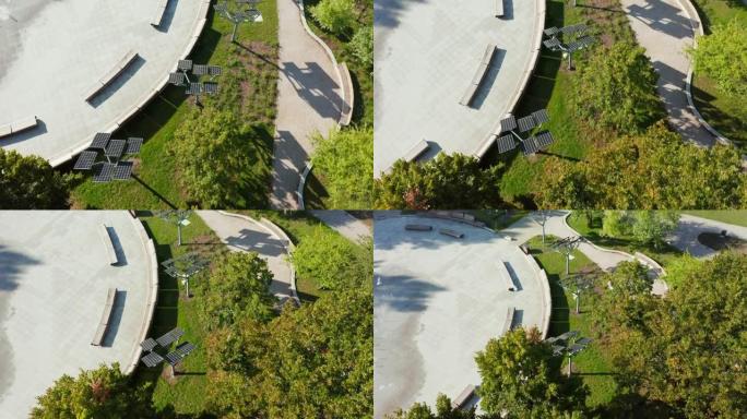 在波兰华沙的喷泉附近安装的公园中一座小型太阳能发电厂的无人机视图。