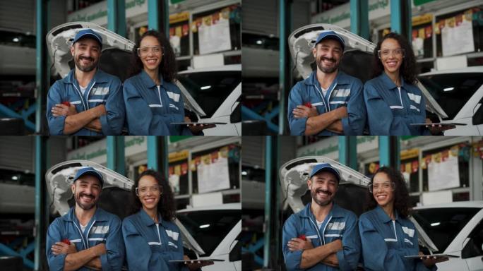 在汽车服务中从事汽车工作的机械师男人和女人。