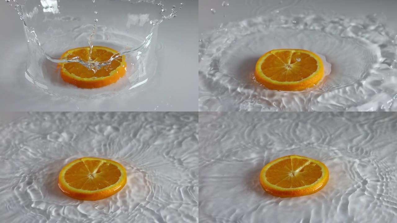 一片橙子掉入水中。慢动作