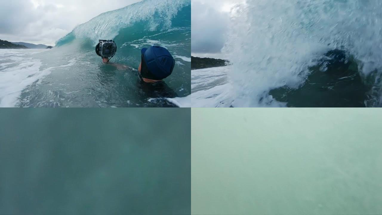 冲浪摄影师。带有动作相机的人拍摄了破浪的照片
