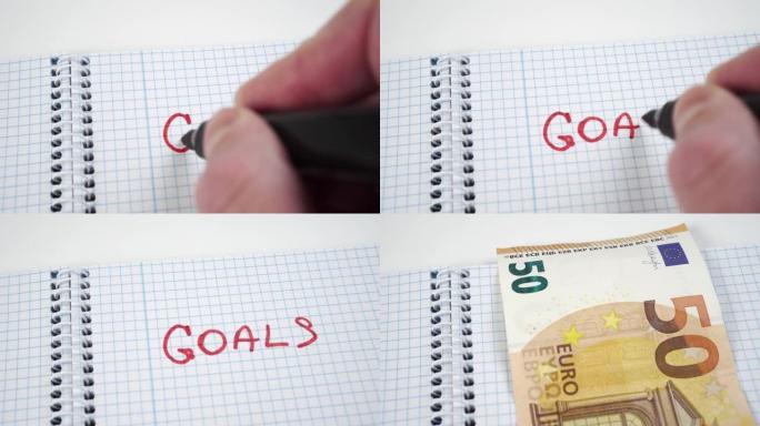 在记事本中写下 “目标” 一词，并在其中用欧元钞票书签关闭笔记本