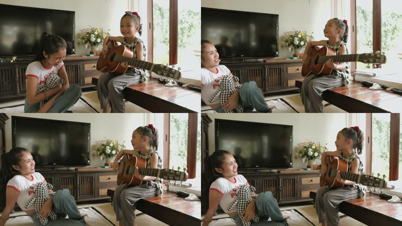 小女孩在家里姐姐旁边弹吉他-股票视频