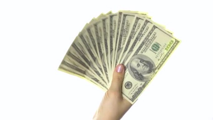 女人的手像扇子一样挥动一百美元的钞票。白色背景。4k