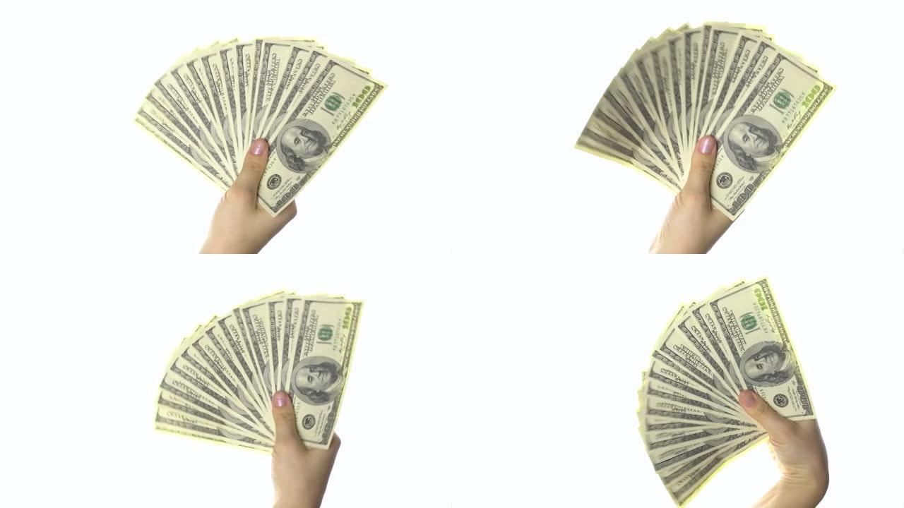 女人的手像扇子一样挥动一百美元的钞票。白色背景。4k