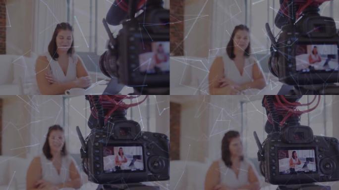 摄像机屏幕上连接网络的动画，女性视频记录器在家录制vlog