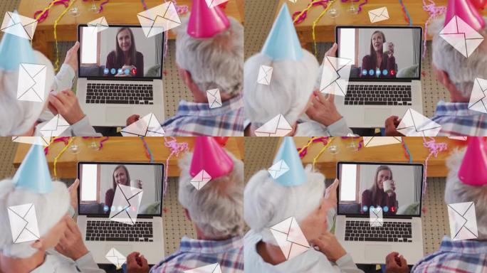 使用笔记本电脑在后面的视频通话中使用戴着派对帽的高级夫妇的邮件信封的动画
