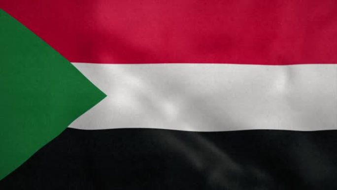 苏丹国旗在风中飘扬。无缝循环